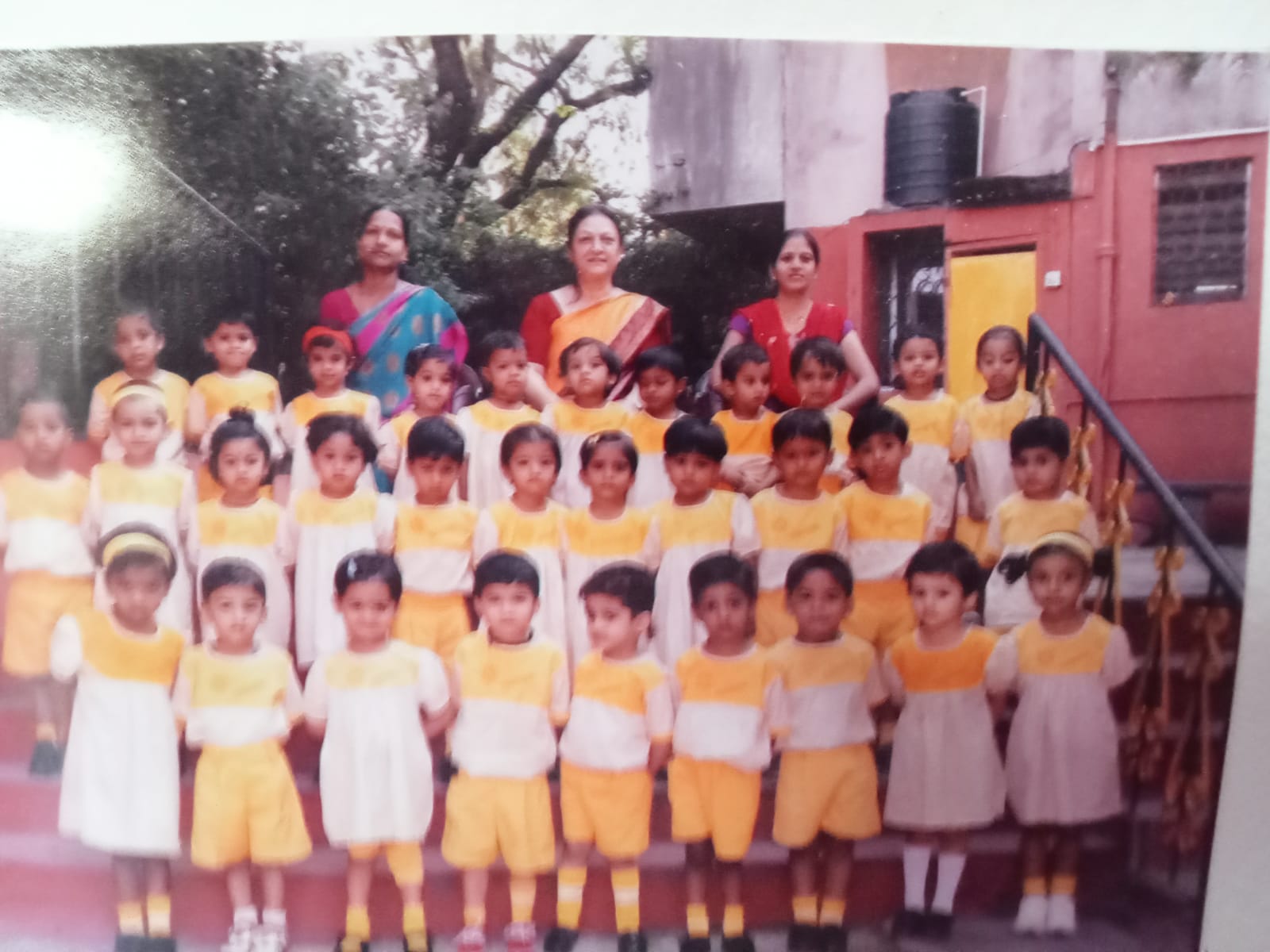 Our Sunbeam Family — Generations of smiling little faces in yellow.